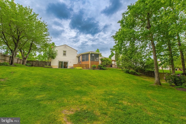 view of yard featuring a sunroom