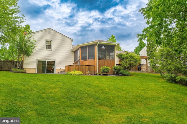 back of property with a sunroom and a chimney