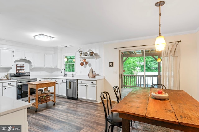 11600 Saddleback Dr, Fredericksburg, VA 22407 - kitchen with appliances with stainless steel finishes, healthy amount of natural light, dark wood-type flooring, white cabinets, and ornamental molding
