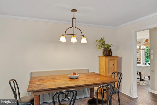 11600 Saddleback Dr, Fredericksburg, VA 22407 - dining area featuring a chandelier, dark wood finished floors, ornamental molding, and baseboards