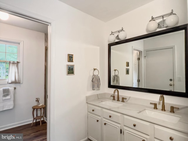 11600 Saddleback Dr, Fredericksburg, VA 22407 - bathroom featuring double vanity, baseboards, and wood finished floors