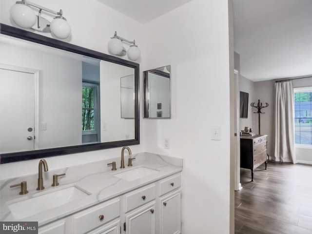 11600 Saddleback Dr, Fredericksburg, VA 22407 - bathroom with double vanity, wood finished floors, and baseboards