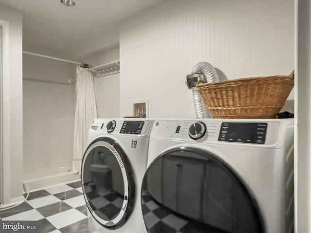 11600 Saddleback Dr, Fredericksburg, VA 22407 - washroom featuring washing machine and clothes dryer, tile patterned floors, and baseboards
