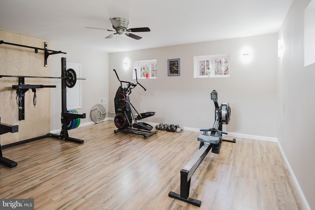 workout area with wood finished floors, baseboards, and ceiling fan