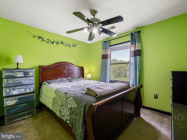 carpeted bedroom featuring baseboards and a ceiling fan