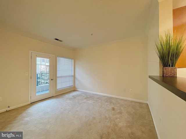 4862 Eisenhower Ave Unit 269, Alexandria, VA 22304 - unfurnished room featuring crown molding, light carpet, and baseboards