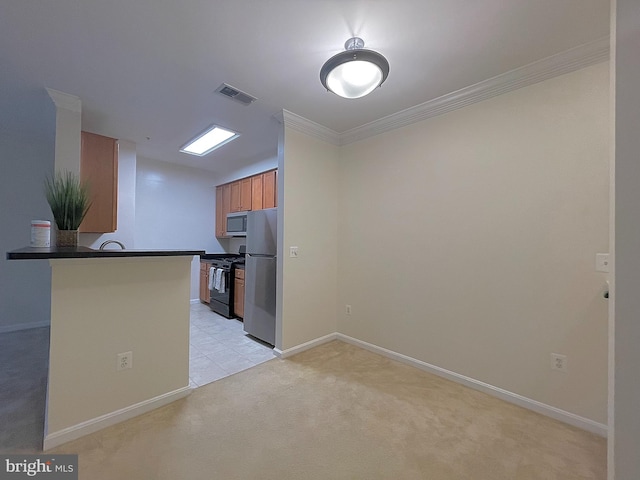 4862 Eisenhower Ave Unit 269, Alexandria, VA 22304 - kitchen with stainless steel appliances, dark countertops, light carpet, crown molding, and baseboards