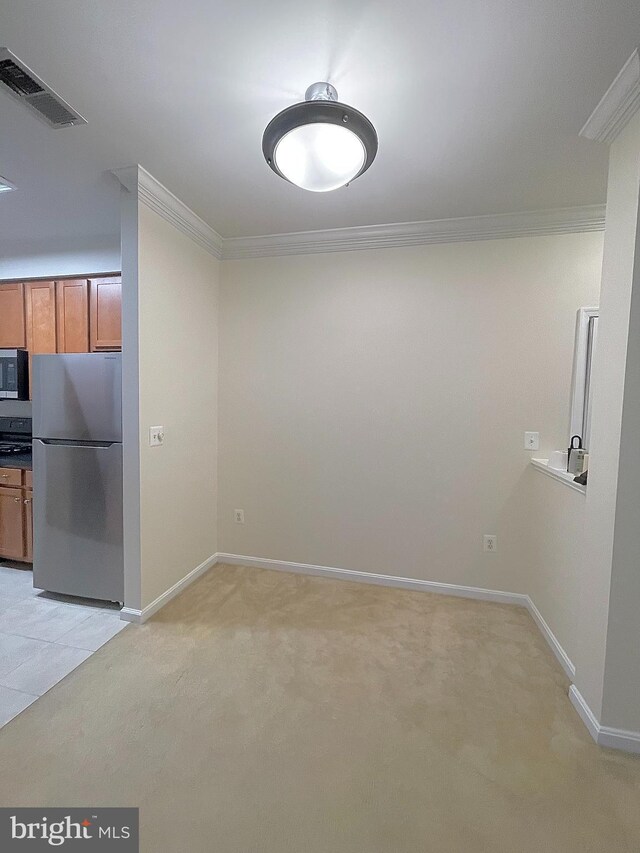 4862 Eisenhower Ave Unit 269, Alexandria, VA 22304 - unfurnished dining area featuring crown molding, light carpet, and baseboards