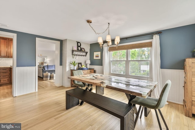2901 N Rochester St, Arlington, VA 22213 - dining room featuring wainscoting, a chandelier, and light wood-type flooring