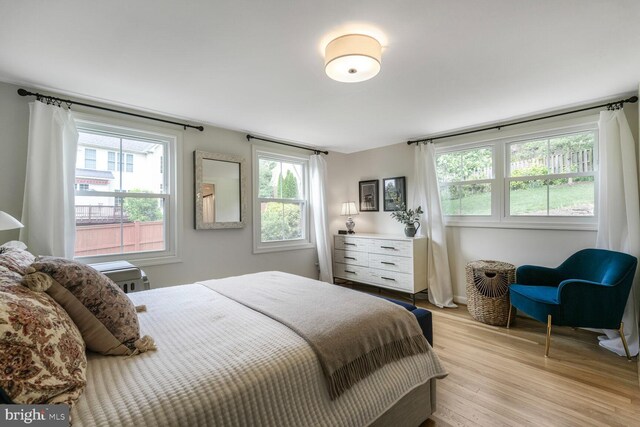 2901 N Rochester St, Arlington, VA 22213 - bedroom featuring multiple windows, light wood finished floors, and baseboards