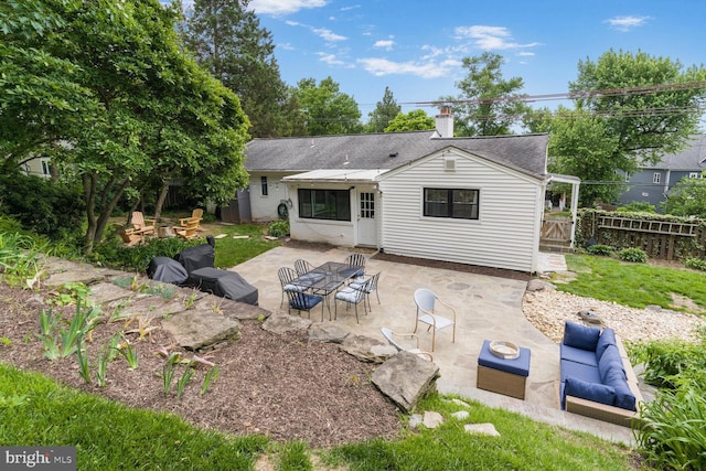 2901 N Rochester St, Arlington, VA 22213 - rear view of property featuring a patio, roof with shingles, a chimney, and an outdoor living space