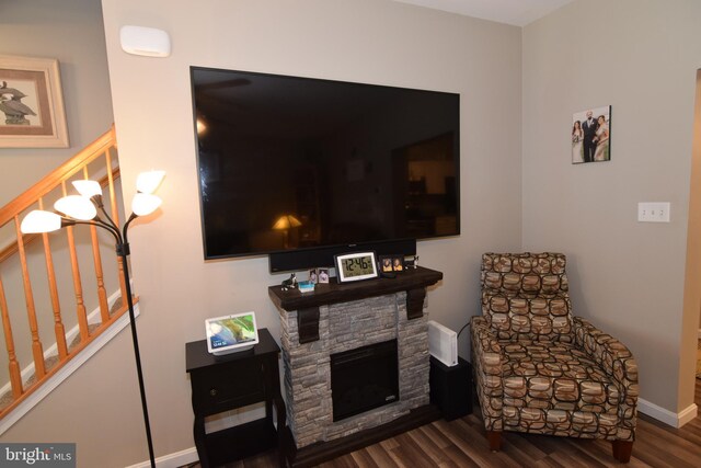 359 Eagle Way, Smyrna, DE 19977 - sitting room featuring wood finished floors, a stone fireplace, baseboards, and stairs