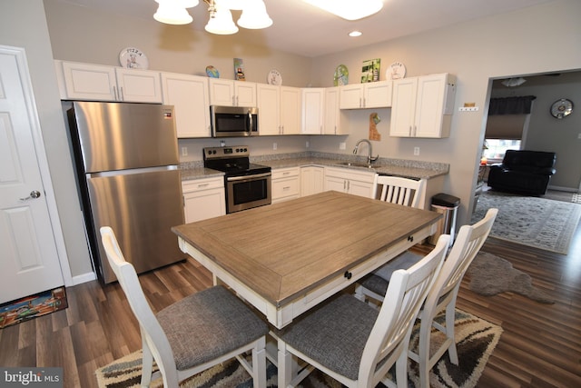 359 Eagle Way, Smyrna, DE 19977 - kitchen featuring appliances with stainless steel finishes, a chandelier, a sink, white cabinets, and recessed lighting