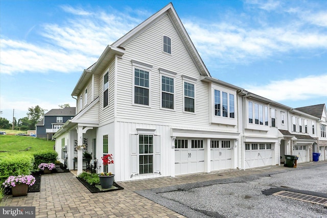 3118 Grove Ct, Mechanicsburg, PA 17055 - view of side of home featuring an attached garage, asphalt driveway, and a residential view