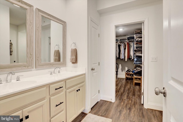 3118 Grove Ct, Mechanicsburg, PA 17055 - full bathroom featuring wood finished floors, double vanity, baseboards, and a spacious closet