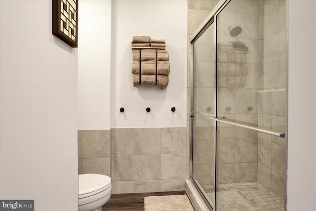 3118 Grove Ct, Mechanicsburg, PA 17055 - full bathroom with a stall shower, toilet, tile walls, and a wainscoted wall