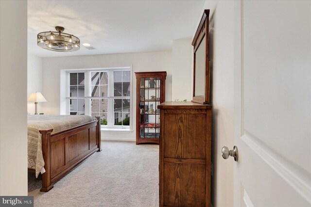 3118 Grove Ct, Mechanicsburg, PA 17055 - bedroom with light carpet and a chandelier