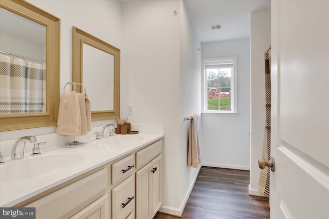 3118 Grove Ct, Mechanicsburg, PA 17055 - bathroom with wood finished floors, double vanity, and baseboards