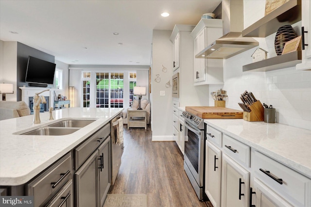 3118 Grove Ct, Mechanicsburg, PA 17055 - kitchen featuring a sink, wall chimney exhaust hood, appliances with stainless steel finishes, open floor plan, and dark wood finished floors