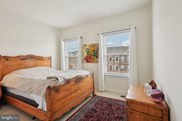 carpeted bedroom with baseboards