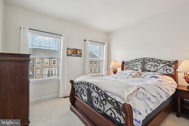 bedroom featuring carpet floors and baseboards