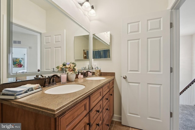 full bath featuring double vanity and tile patterned floors