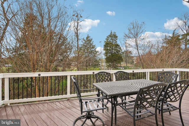 wooden deck with outdoor dining space