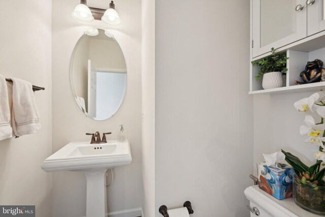 half bath featuring toilet