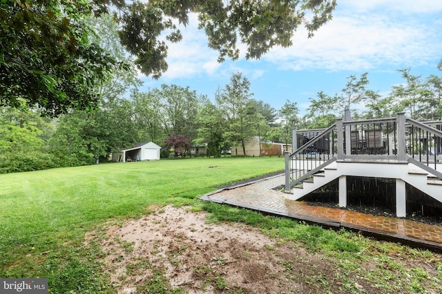 10303 Coppermine Ct, Union Bridge, MD 21791 - view of grassy yard with stairway, a wooden deck, and an outdoor structure