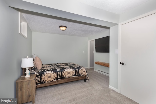 10303 Coppermine Ct, Union Bridge, MD 21791 - bedroom with carpet, a textured ceiling, a baseboard heating unit, and baseboards