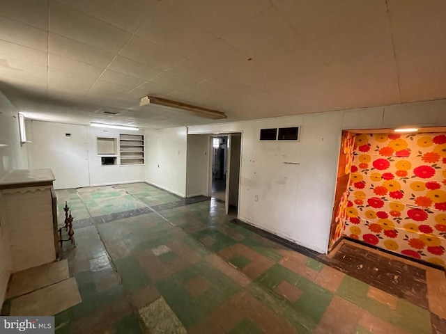 spare room featuring dark floors