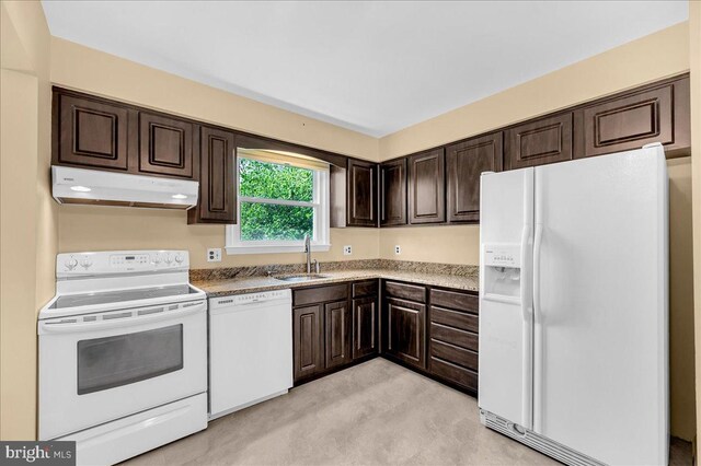 100 Median Dr, Wilmimgton, DE 19803 - kitchen with white appliances, under cabinet range hood, a sink, and dark brown cabinetry