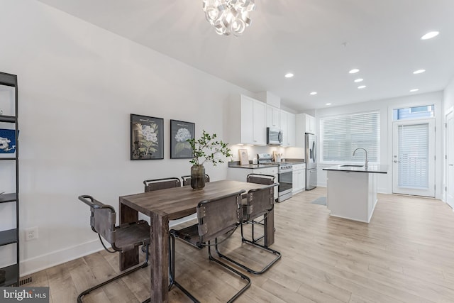 11244 Faraday Park Dr, Reston, VA 20190 - dining room featuring light wood-style floors, recessed lighting, baseboards, and a chandelier