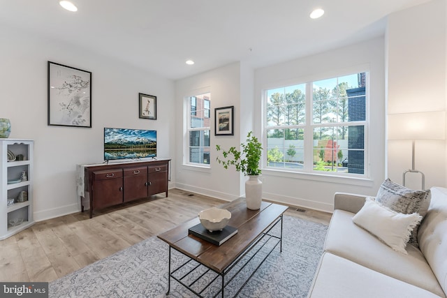 11244 Faraday Park Dr, Reston, VA 20190 - living room with light wood-style flooring, recessed lighting, and baseboards