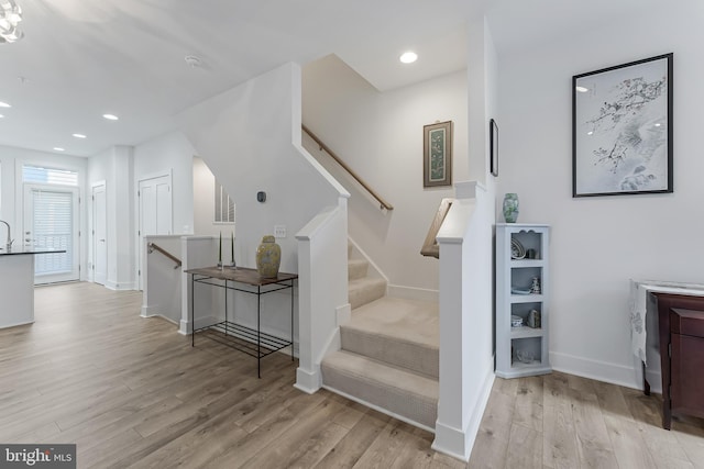 11244 Faraday Park Dr, Reston, VA 20190 - stairway featuring wood finished floors, recessed lighting, and baseboards