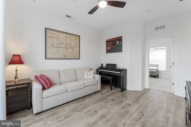 11244 Faraday Park Dr, Reston, VA 20190 - living room featuring ceiling fan, light wood-type flooring, and baseboards