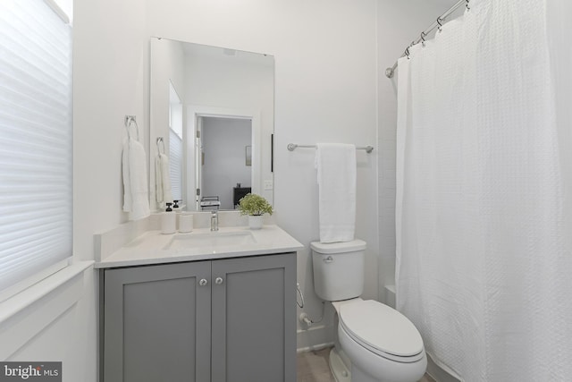 11244 Faraday Park Dr, Reston, VA 20190 - bathroom with toilet, vanity, and shower / bathtub combination with curtain