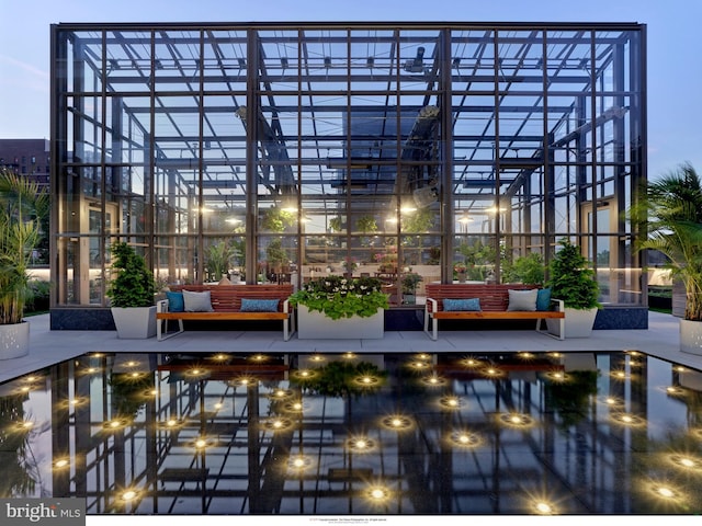 surrounding community featuring outdoor lounge area and a pool
