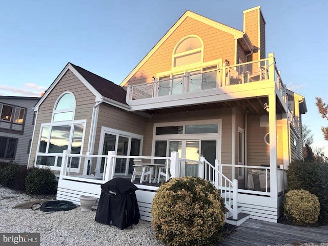 18 Ebb Tide Ct, Ocean Pines, MD 21811 - rear view of house with a balcony and a chimney