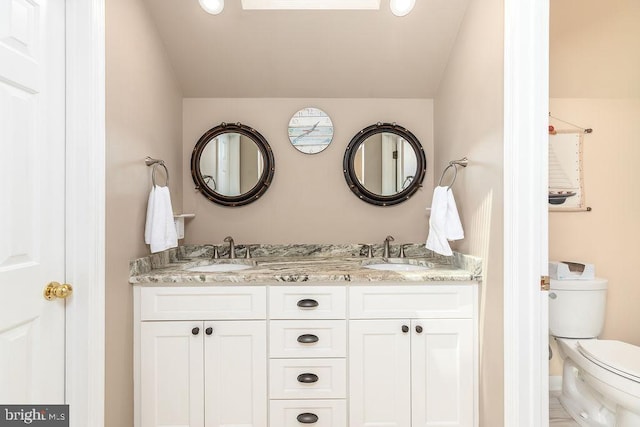 18 Ebb Tide Ct, Ocean Pines, MD 21811 - bathroom featuring toilet and double vanity