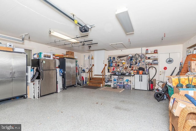 18 Ebb Tide Ct, Ocean Pines, MD 21811 - garage featuring freestanding refrigerator and a garage door opener