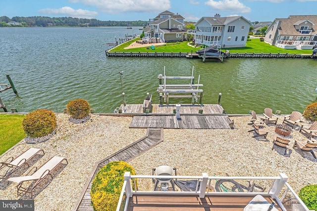 18 Ebb Tide Ct, Ocean Pines, MD 21811 - dock area featuring an outdoor fire pit, a water view, boat lift, and a residential view