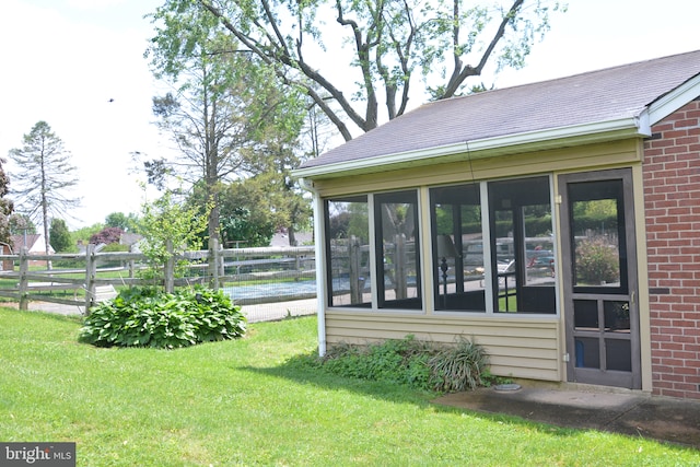 view of yard featuring a sunroom