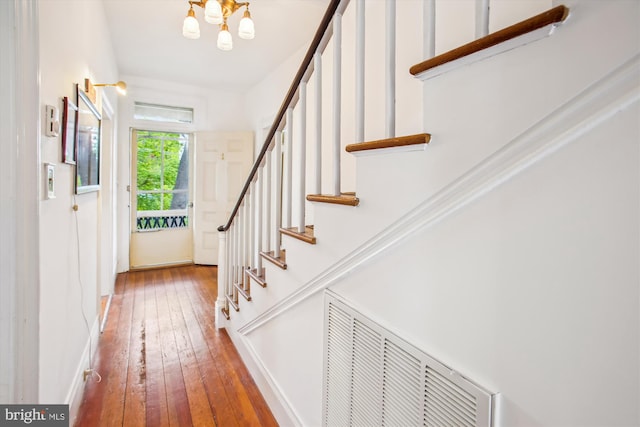 501 Park Row Pl, Harpers Ferry, WV 25425 - foyer entrance with stairway, wood-type flooring, a chandelier, and baseboards