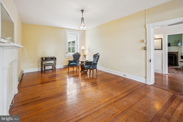 501 Park Row Pl, Harpers Ferry, WV 25425 - living area featuring a fireplace, hardwood / wood-style floors, baseboard heating, and baseboards