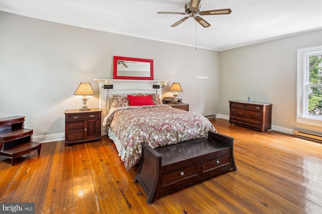 501 Park Row Pl, Harpers Ferry, WV 25425 - bedroom with hardwood / wood-style floors, baseboards, a baseboard heating unit, baseboard heating, and ornamental molding