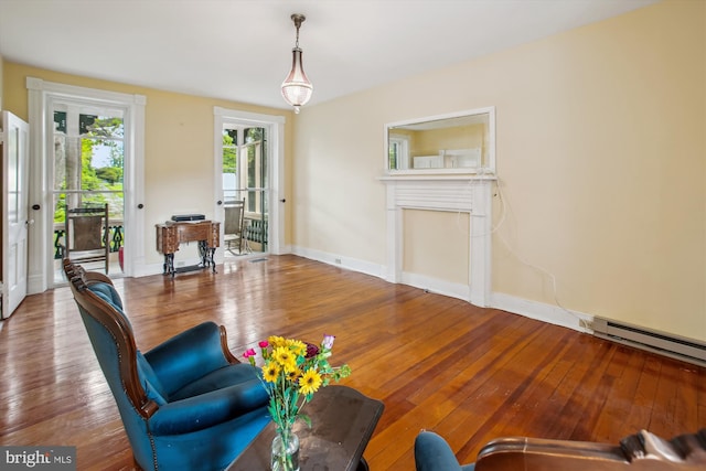 501 Park Row Pl, Harpers Ferry, WV 25425 - living area featuring hardwood / wood-style floors, a fireplace, baseboards, and a baseboard heating unit