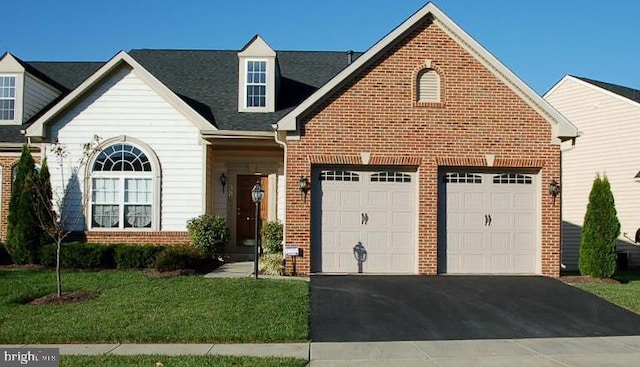 5808 Hollys Way Unit 71, New Market, MD 21774 - traditional-style home featuring brick siding, asphalt driveway, an attached garage, a front yard, and roof with shingles