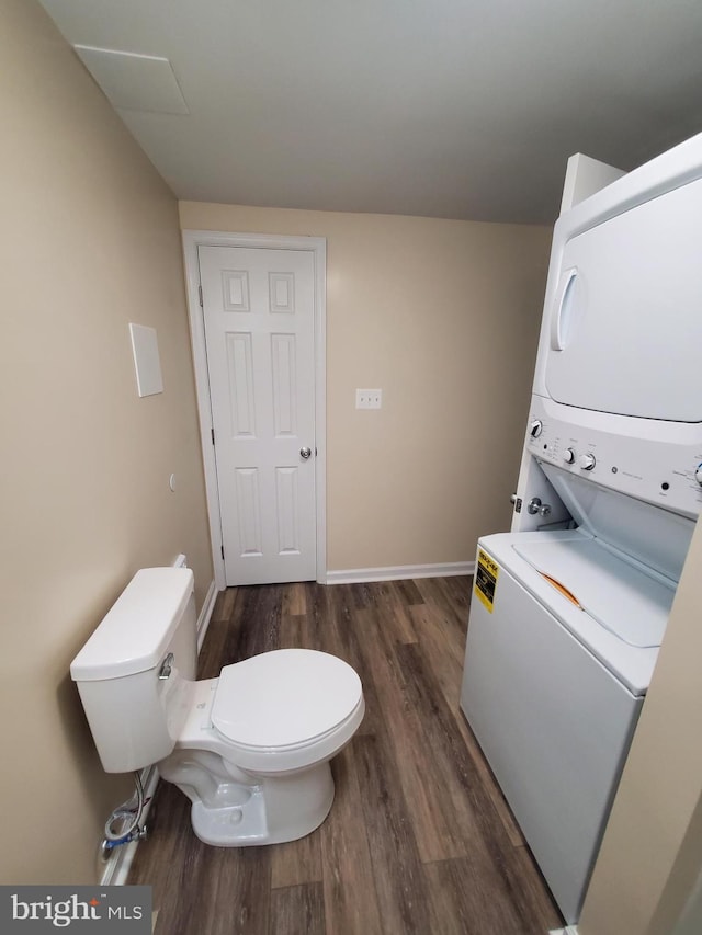 117 S Shenandoah Ave, Front Royal, VA 22630 - clothes washing area with estacked washer and dryer, dark wood finished floors, and baseboards