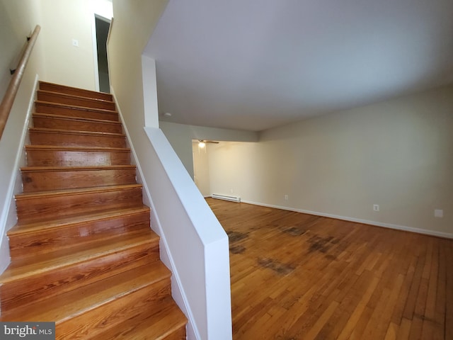 117 S Shenandoah Ave, Front Royal, VA 22630 - stairway with hardwood / wood-style floors, a baseboard radiator, and baseboards